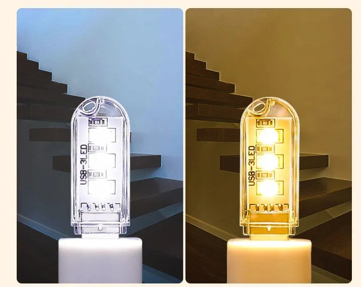 Small white USB LED baby night light showing warm and white light modes on a table.