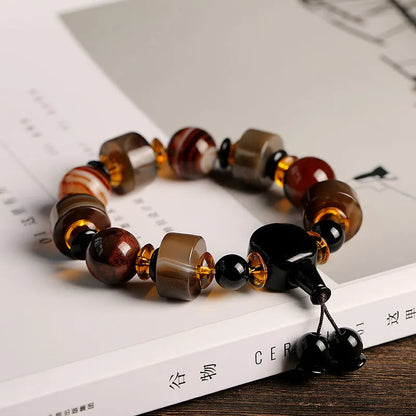 Natural agate ethnic bracelet with geometric design featuring multiple agate bead types and sizes