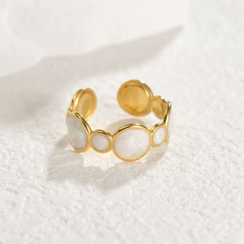 Adjustable geometric stainless steel ring with electroplated finish showing angular design and opening mechanism
