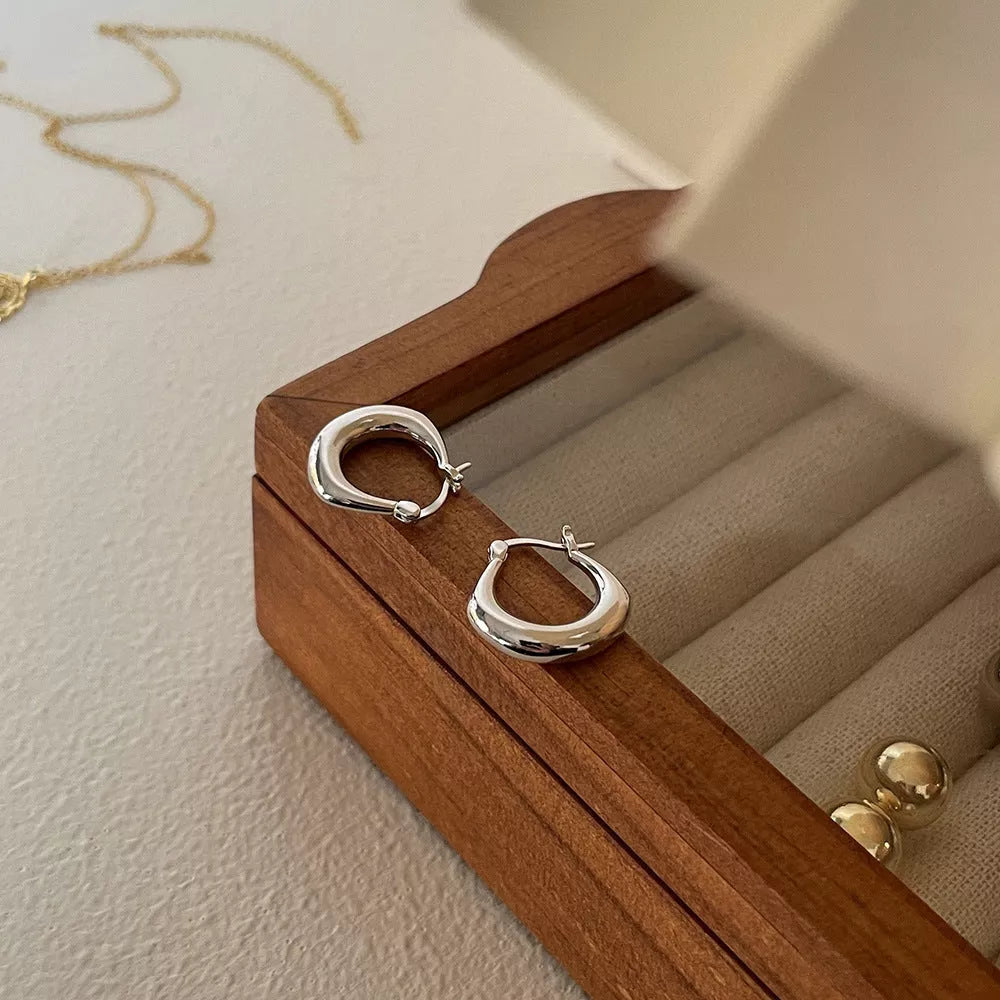 Small Fat Circle Ear Clip Bracelet in white gold and yellow gold colors