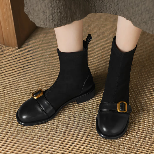 Women's black casual Martin boots with low heel, lace-up front, and decorative belt buckle stitching.