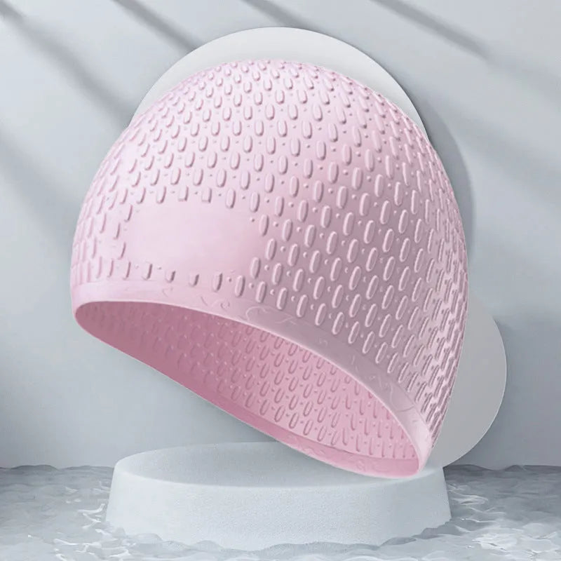 Silicone water drop swimming cap for adults shown in one of nine solid colours.