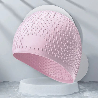Silicone water drop swimming cap for adults shown in one of nine solid colours.