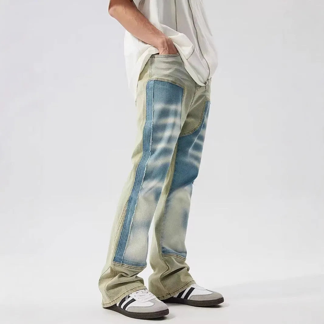Yellow and blue patchwork splash-ink damaged design denim jeans with mid-waist cut and zip placket closure