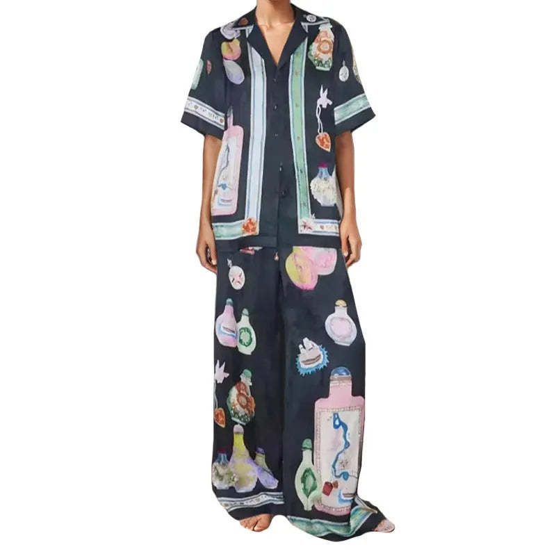 Black women's cardigan set with cartoon animation print, showing top with regular sleeves and matching trousers
