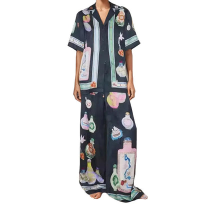Black women's cardigan set with cartoon animation print, showing top with regular sleeves and matching trousers