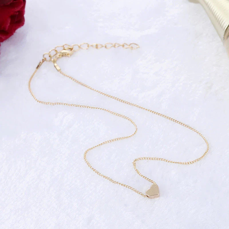 Elegant clavicle necklace with a double-sided love pendant, made of high-quality alloy for a timeless, fashion-forward look.