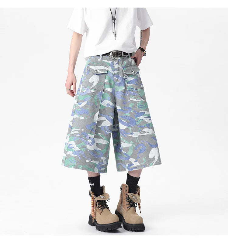 Denim workwear trousers with camouflage colour pattern, straight-leg cut, and zipper fly