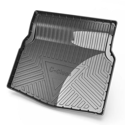 Black car boot liner with carbon fibre texture, tailored to fit a specific vehicle model's load area.