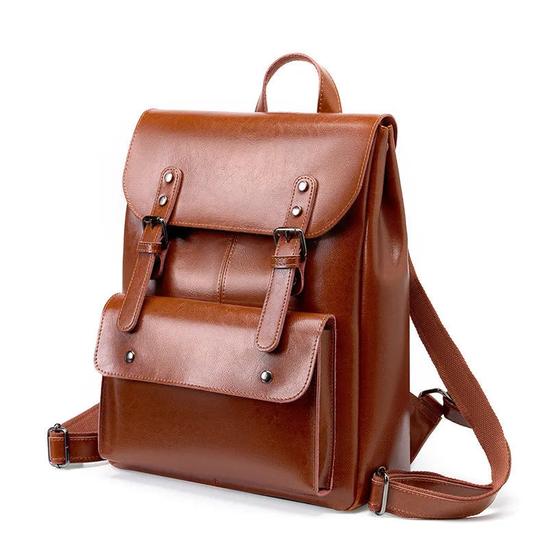 Genuine cowhide leather backpack for women in black, brown, or coffee, showing hard-textured two-layer construction.