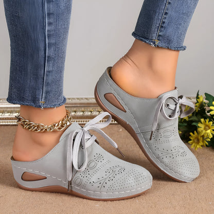 Women's summer lace-up slippers with hollow-out wedge design in black, suede upper, and rubber sole