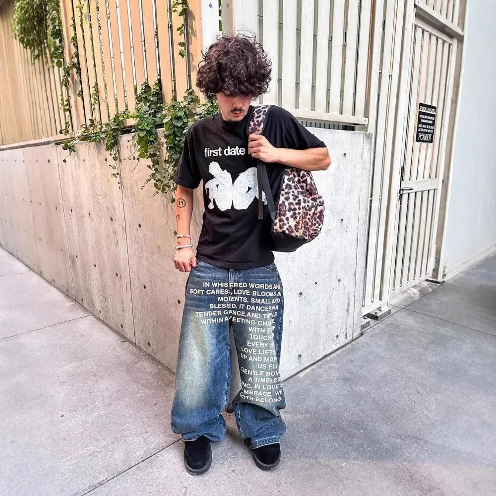 Men's black wide-leg cotton casual trousers showing loose straight cut