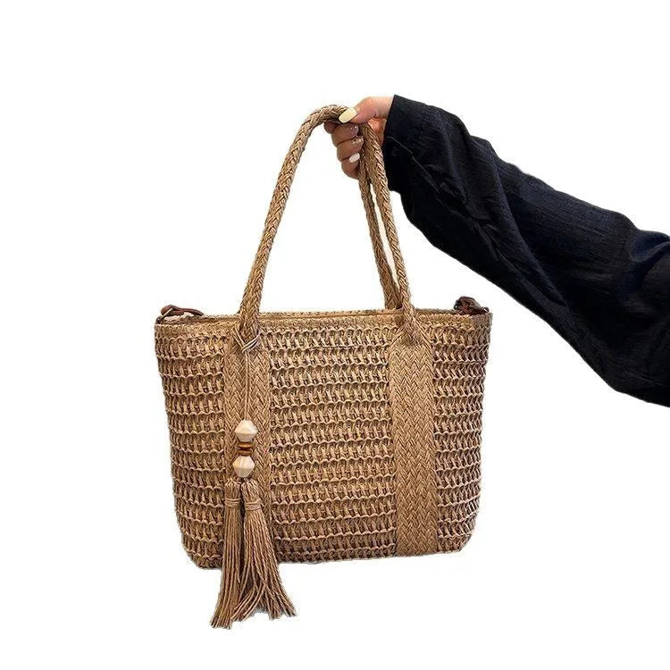 Women's large capacity straw crossbody bag in milky white or khaki with soft woven body and shoulder strap