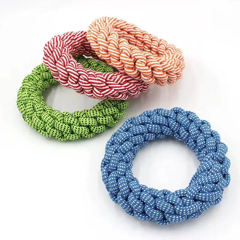 Cotton string braided ring knot dog chew toy showing woven texture and ring shape