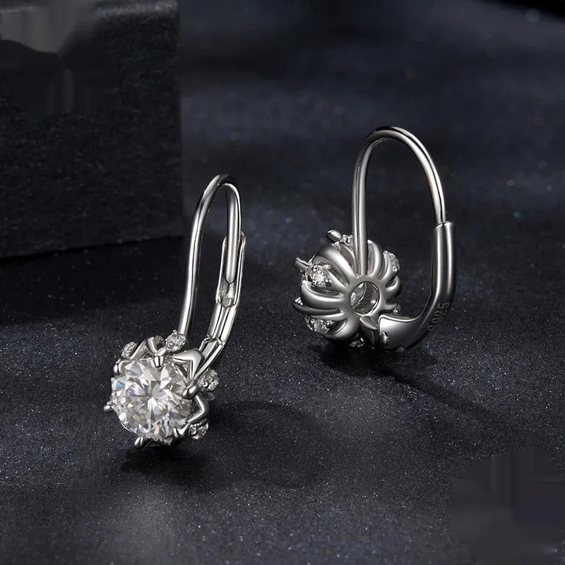 Sterling silver flower bud ear clips with white gold plating and moissanite centre stone