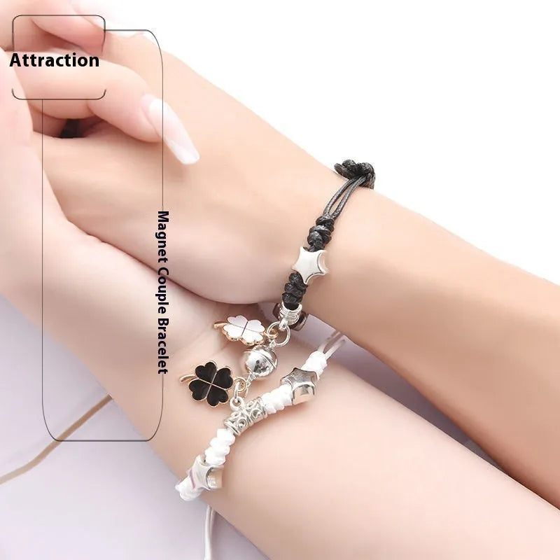 Magnetic suction couple bracelet pair in alloy with an electroplated finish, showing example designs like a crown and love lock.