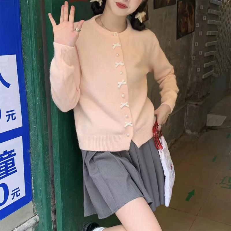 Women's Cashmere Blend Sweater with Cardigan Style, Bow Pattern, and Pearl Buttons in Multiple Solid Colours including Pink, White, Light Yellow, Turquoise, Black, Grey, Red, Light Blue, and Dark Yellow for Fresh and Sweet Spring and Autumn Wear