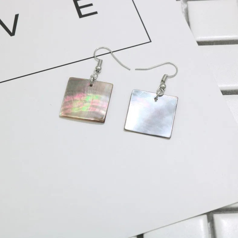 Natural shell earrings in geometric square and rectangular shapes with panther pattern detailing