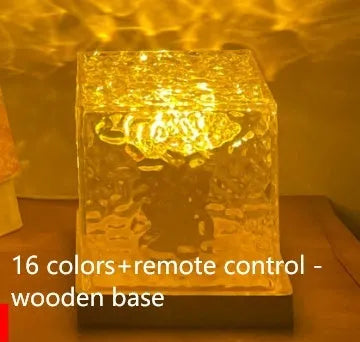 LED water ripple projection night light with remote control on wooden base showing colourful light patterns