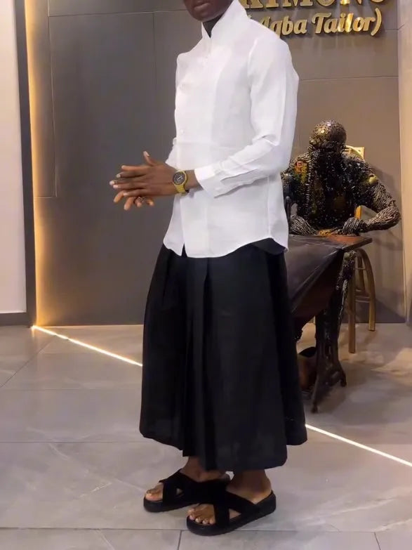 Women's casual two-piece set featuring a white asymmetric front long-sleeve shirt paired with black pleated pants in regular fit polyester for daily wear, available in sizes S to 2XL.