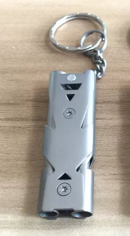 Durable metal keychain whistle in silver and black, compact design for safety