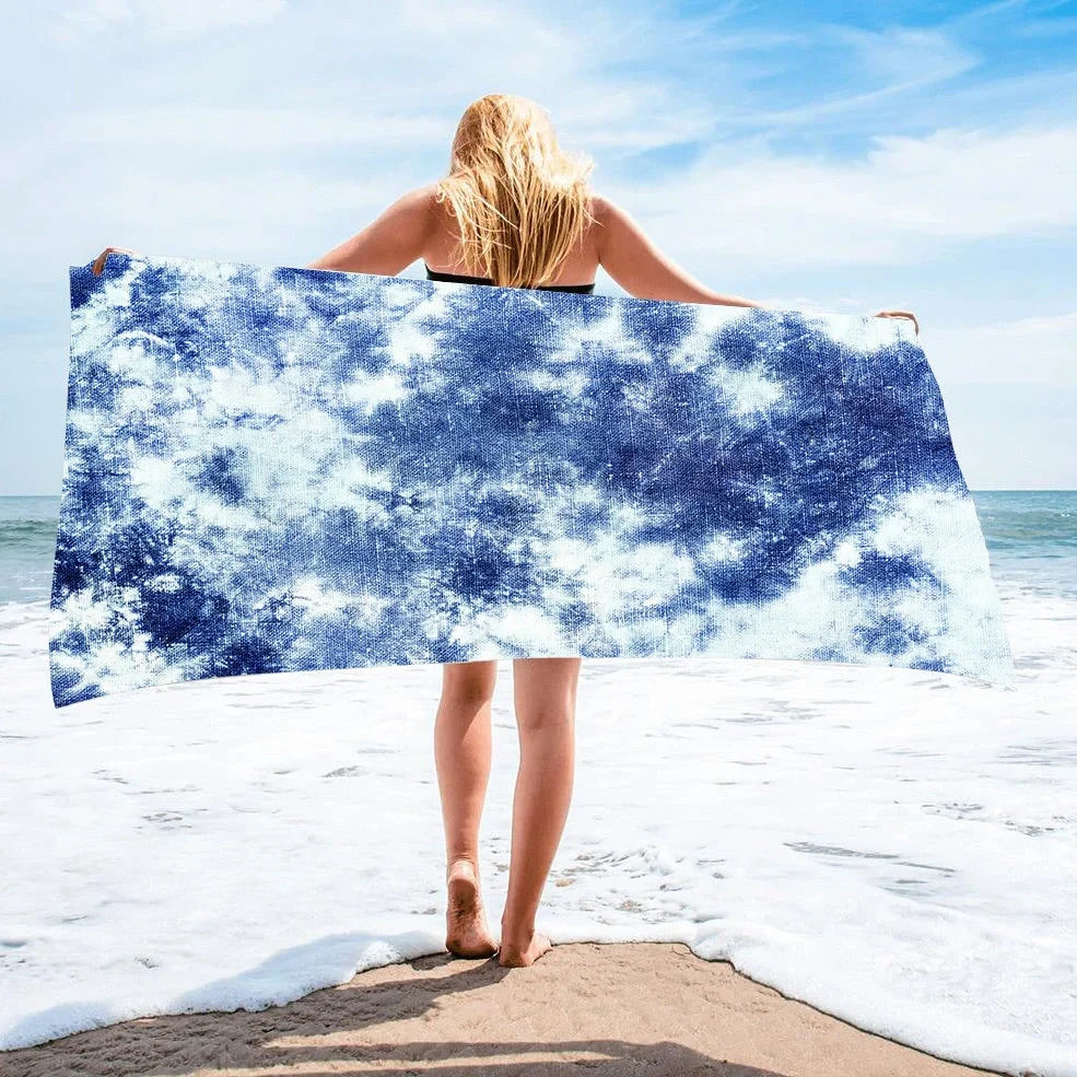 Square beach towel with tie-dye pattern showing superfine fibre texture and vibrant colours