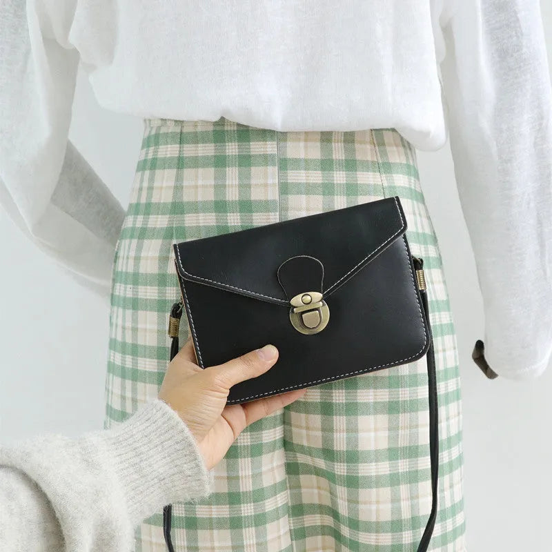 Retro soft brown crossbody messenger bag with a flap and lock closure