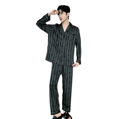 Black stripes men's ice silk pyjama set with V-neck top and long trousers on a hanger.