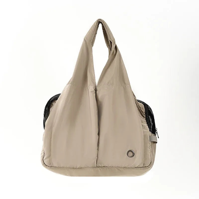 Apricot coloured soft cloth portable pet carrier handbag for small dogs and cats.