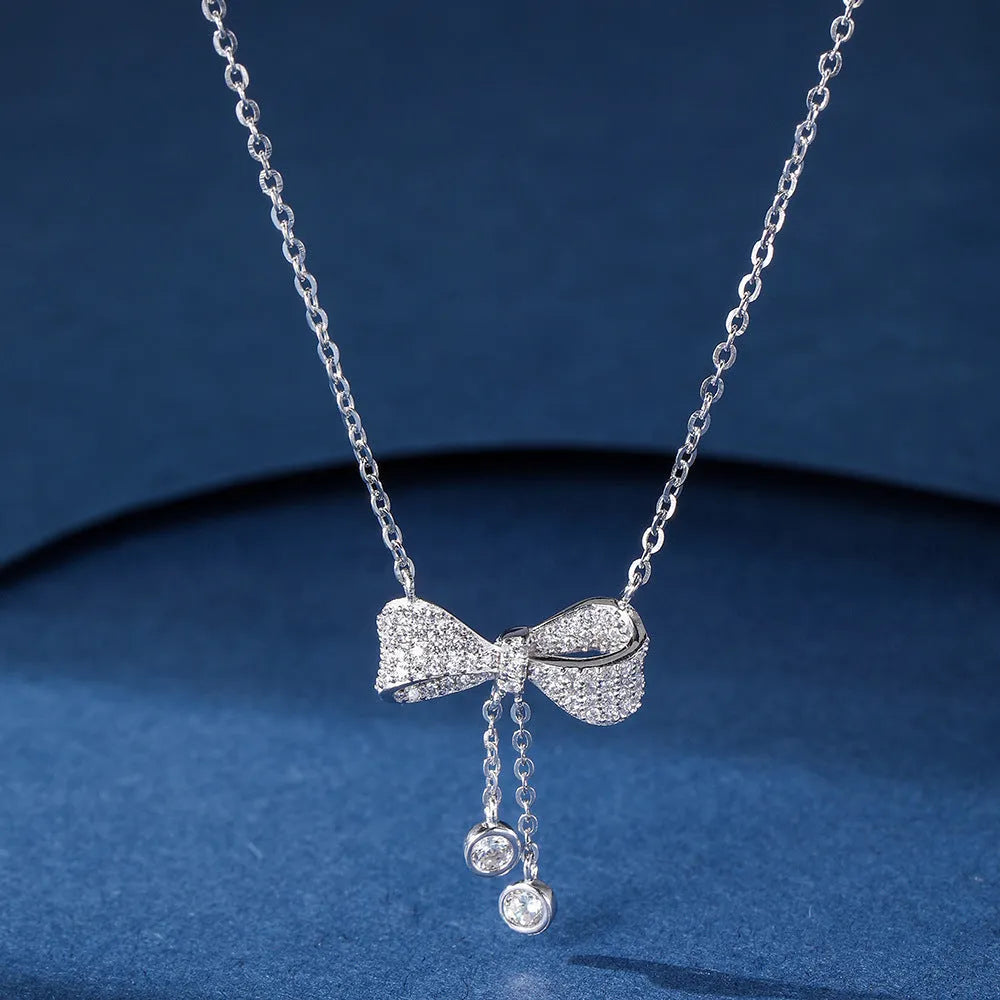S925 sterling silver bow pendant necklace on an O-ring chain, adjustable from 40cm to 45cm.