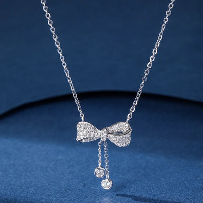 S925 sterling silver bow pendant necklace on an O-ring chain, adjustable from 40cm to 45cm.