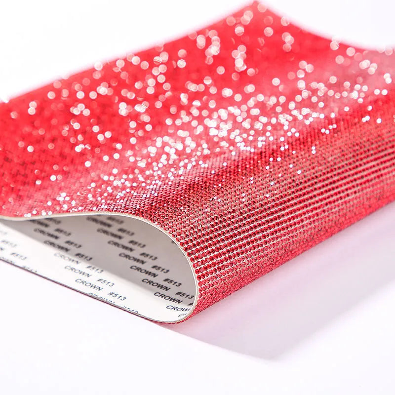 Rhinestone sticker net on backing sheet for hot drilling application to fabrics in multiple colour options