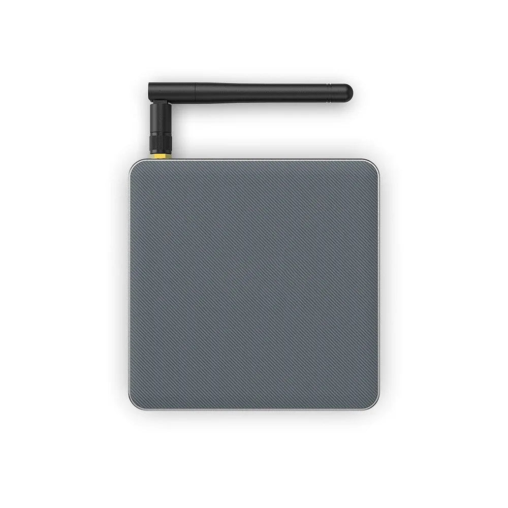 Android TV set-top box with remote control showing HDMI and power ports