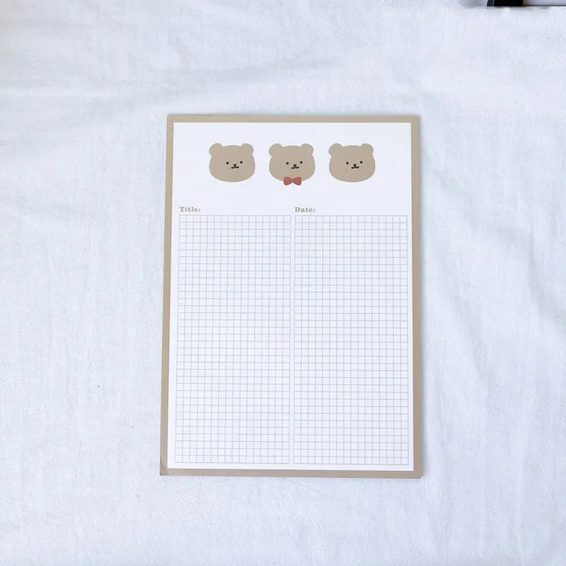 Cartoon sticky note pad in avocado or bear design, showing large and small size options next to a pen.