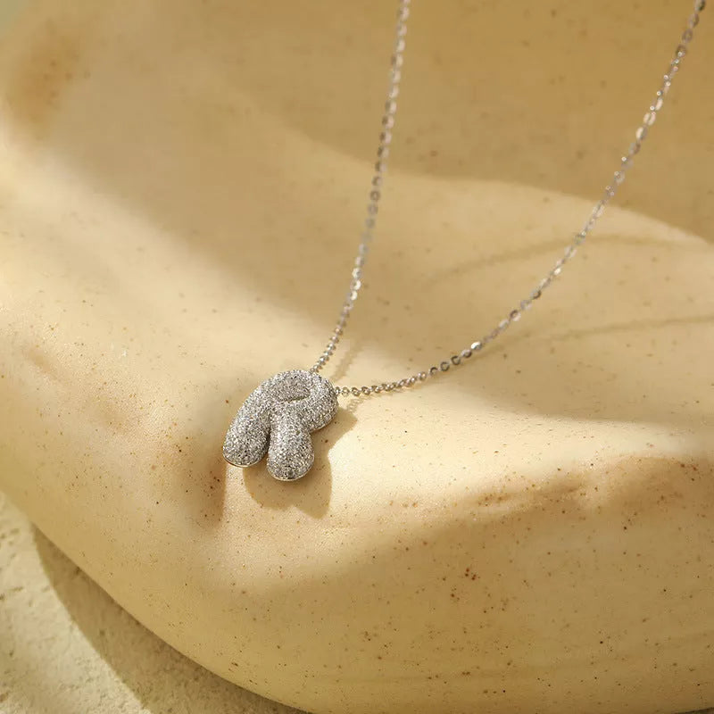 Stainless steel initial pendant necklace with zircon accents, personalized with your choice of letter.