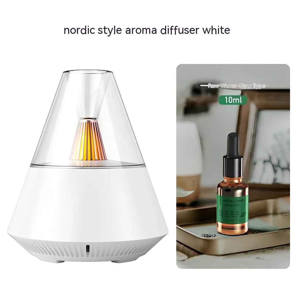 Compact black aroma diffuser humidifier with remote control on wooden surface