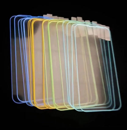 Fluorescent tempered glass screen protector glowing in blue for iPhone with full-screen coverage
