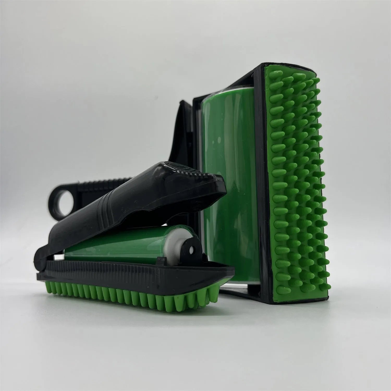 Yellow and green washable reusable lint rollers for pet hair removal on fabrics and carpets.