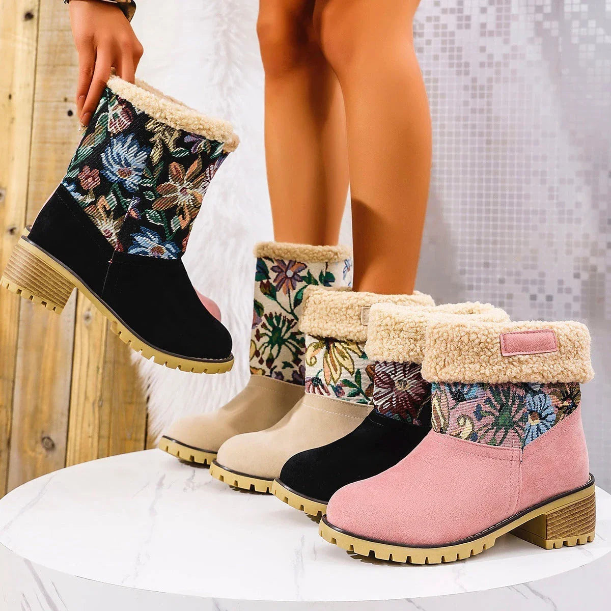 Floral embroidered snow boots in off-white, black, and pink colors with thick square heels and round toe shape