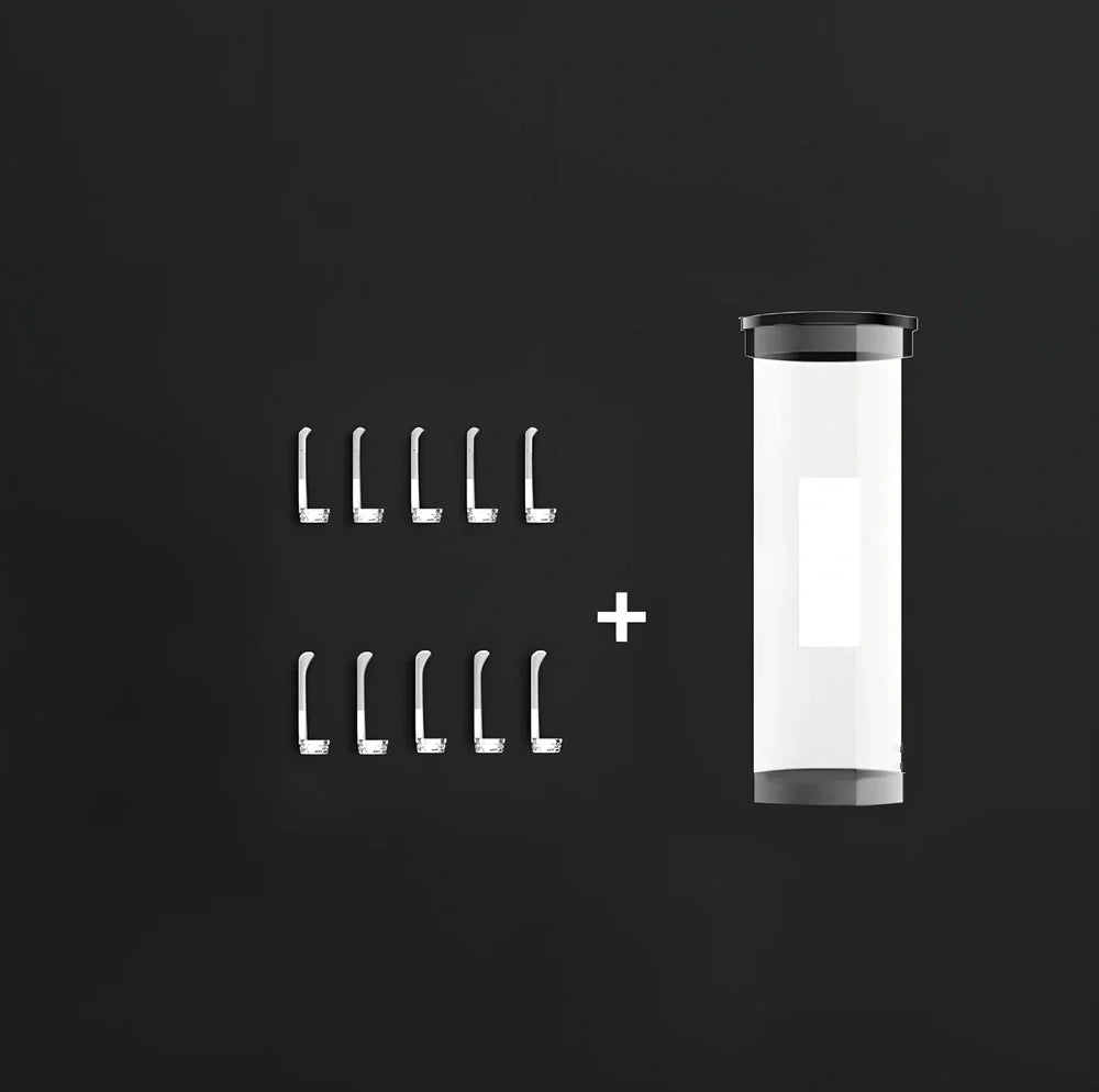 Visual ear cleaning device with camera, ear scoop attachments, and charging cable on white background