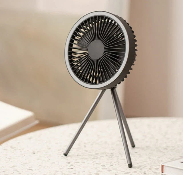 Versatile USB Rechargeable Camping Fan with Tripod Stand and Lantern, offering a premium aluminum alloy construction, 3-in-1 design, and powerful brushless motor for a refreshing outdoor experience.
