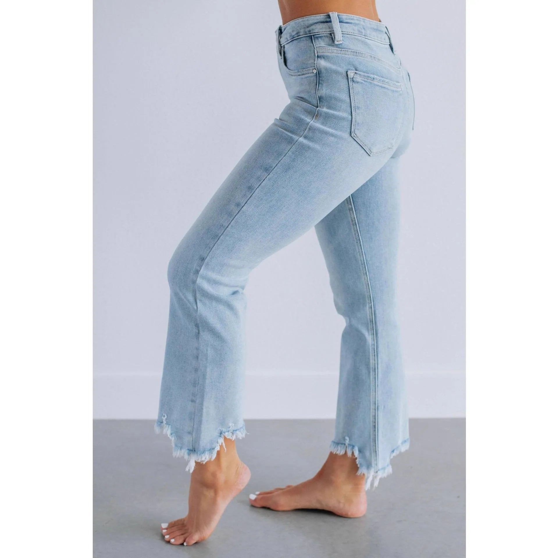 Women's solid colour denim trousers with hand-worn finish in dark blue, showing casual styling and 100% cotton construction