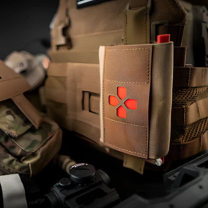 Nylon first-aid kit in camouflage pattern with organised medical supply compartments