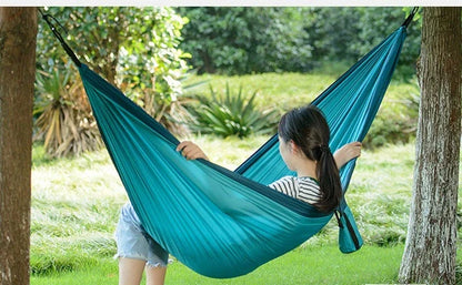Comfortable and durable camping hammock in various colors, perfect for outdoor adventures and relaxation