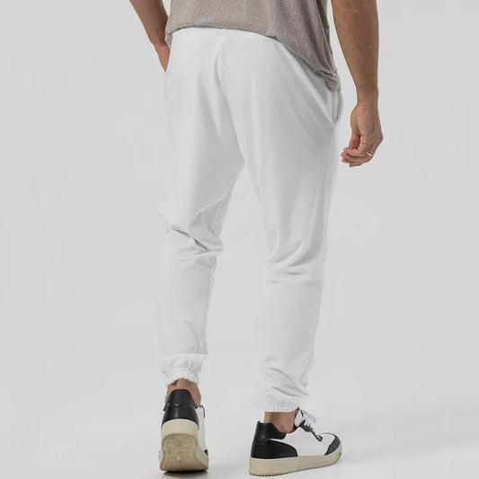 Men's grey casual track sweatpants with loose tapered fit and elastic waistband