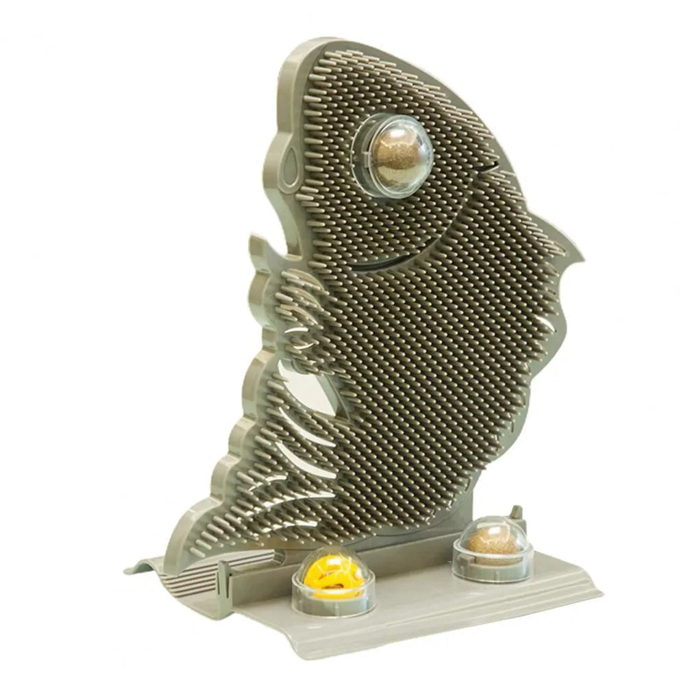 Blue fish-shaped cat wall scratcher with grooming brush, two catnip balls, and bell on white base
