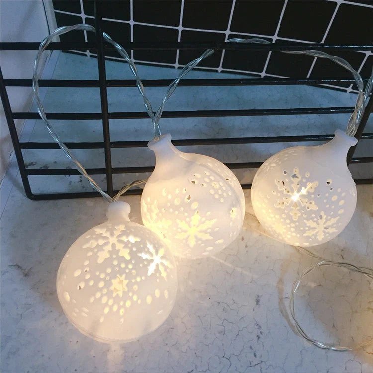 Festive Navidad LED string lights in Snowman, Snow Ball, and Santa Claus colors for holiday decorations