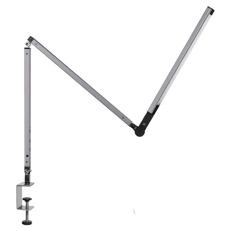 Clip-on adjustable arm LED desk lamp in black mounted on a desk edge with remote control.