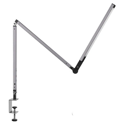Clip-on adjustable arm LED desk lamp in black mounted on a desk edge with remote control.