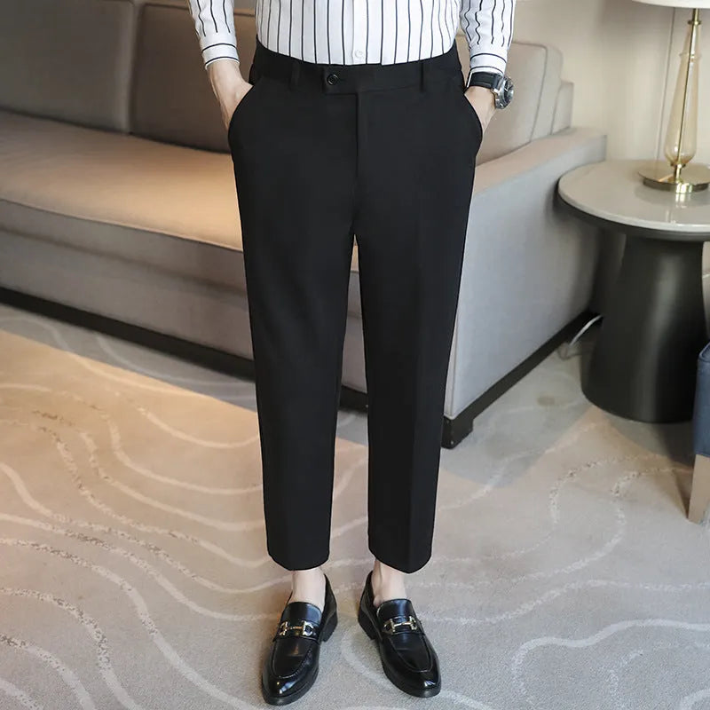 Straight-leg brown corduroy trousers with elastic waistband and slim fit design
